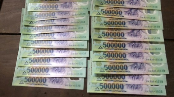  Tang vật tiền giả công an thu giữ. Ảnh: CA