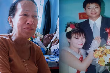  Mỗi khi ngắm lại tấm hình cưới của Thanh và chồng, bà Muối lại rưng rưng. Ảnh: Tú Anh.