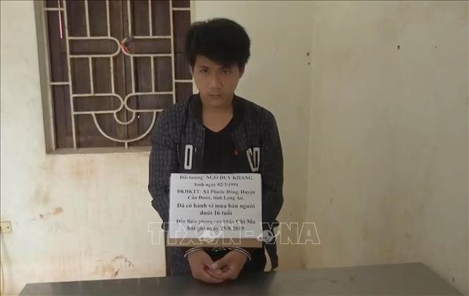 Đối tượng Ngô Duy Khang tại cơ quan điều tra. Ảnh: Quang Duy/TTXVN