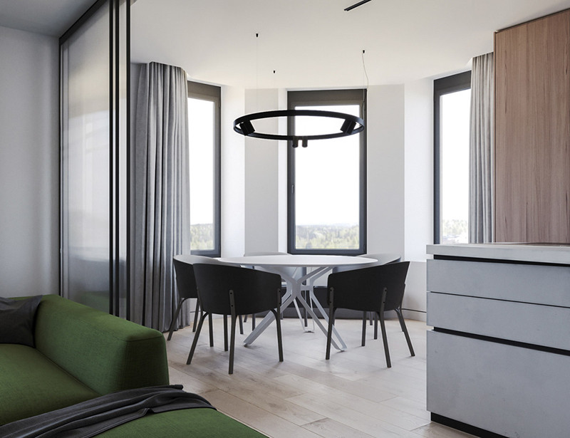 Ghế ăn hiện đại màu đen bao quanh một chiếc bàn màu trắng tạo sự tương phản mạnh mẽ.