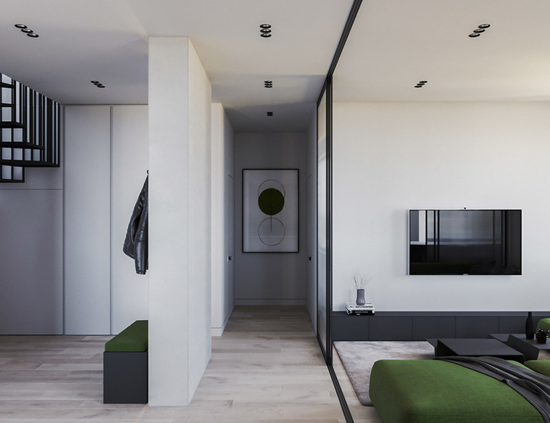  Một bức tường đóng vai trò là vách ngăn phòng giữa phòng khách mở và hành lang cạnh cầu thang.
