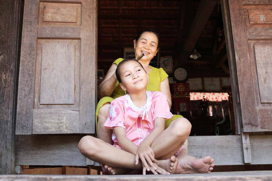 Bà Đinh Thị Dúng (thôn 7) Tôi sẽ giữ nếp nhà sàn đến hết đời mình. Ảnh: Phương Duyên