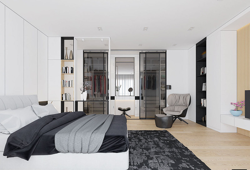 Bức tường nhỏ giữa giường và tủ quần áo tạo ra một hành lang giả nhỏ, một ranh giới mang tính biểu tượng thuần túy vẫn cho phép ánh sáng mặt trời tiếp tục hướng về các khu vực chức năng ở phía bên kia.