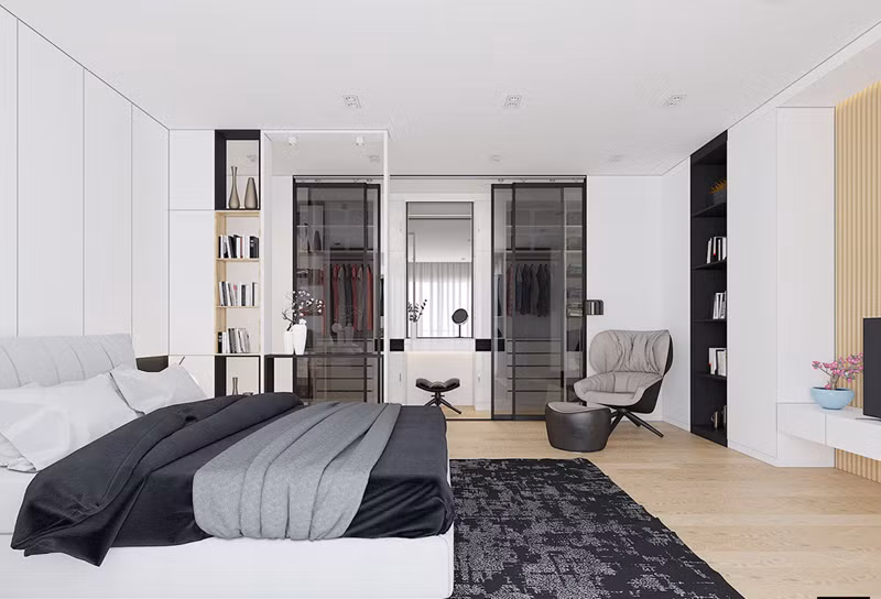 Bức tường nhỏ giữa giường và tủ quần áo tạo ra một hành lang giả nhỏ, một ranh giới mang tính biểu tượng thuần túy vẫn cho phép ánh sáng mặt trời tiếp tục hướng về các khu vực chức năng ở phía bên kia.