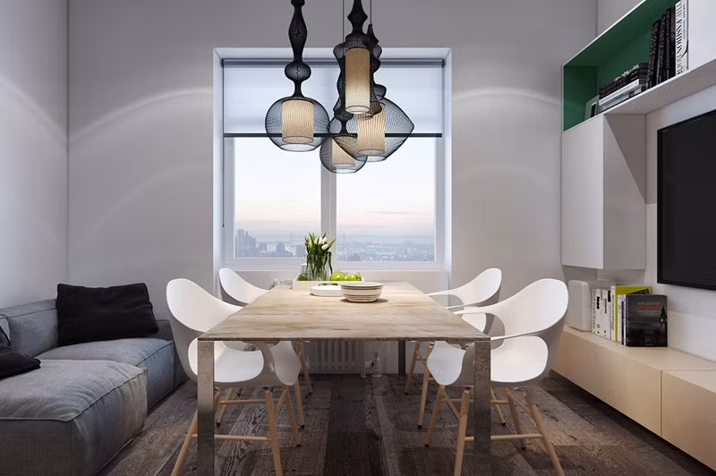 Việc kết hợp bàn ăn với bàn phòng khách giúp căn hộ 39 m2 tiết kiệm được tối đa diện tích.