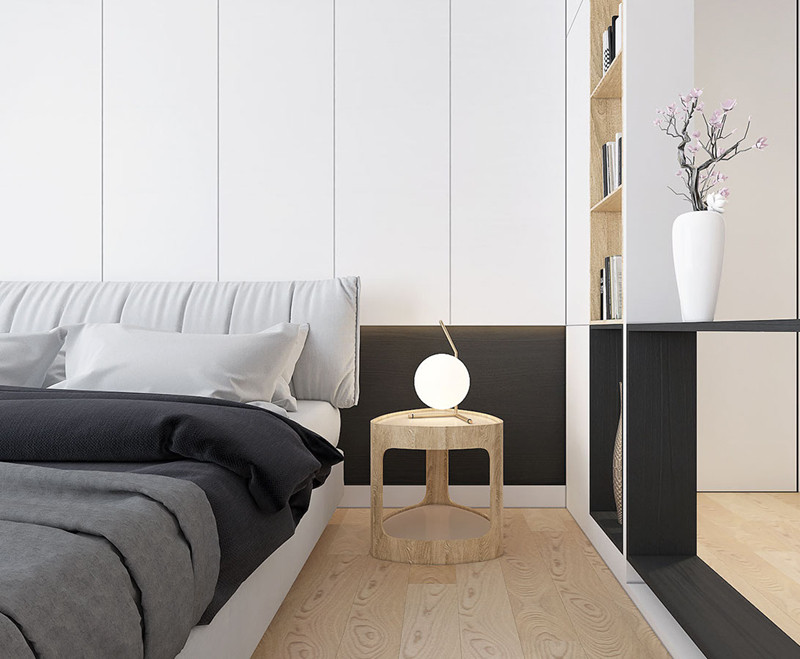  Một chiếc đèn ngủ nhỏ đặt trên bàn cạnh giường dùng để đọc sách.