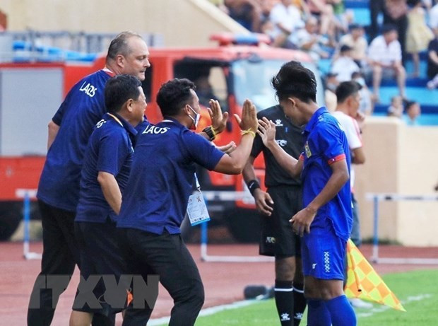 Ban huấn luyện U23 Lào ăn mừng khi các cầu thủ ghi bàn thắng thứ hai. Ảnh: Tuấn Anh/TTXVN