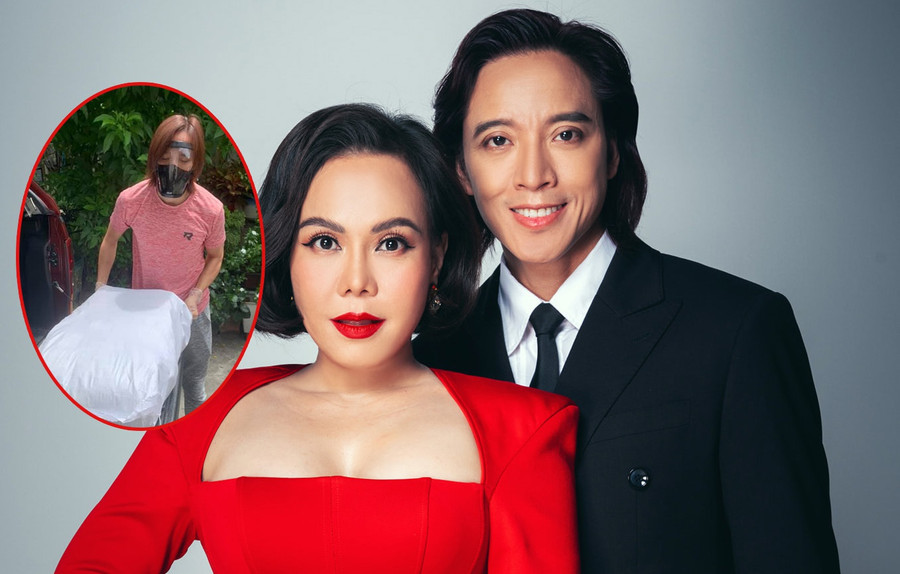 Việt Hương và ông xã trao các nhu yếu phẩm, bánh cho người dân, các lực lượng tuyến đầu. Ảnh: FBNV