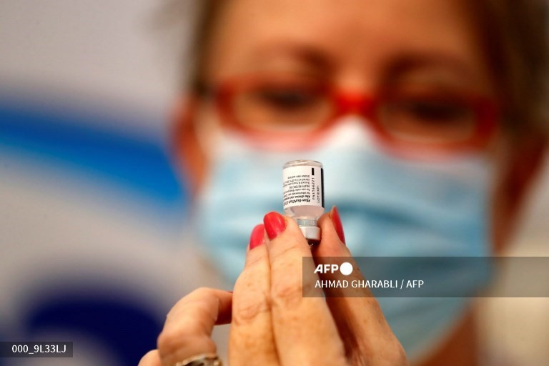 Vaccine COVID-19 Pfizer vẫn có hiệu quả chống lại virus sau 6 tháng. Ảnh: AFP