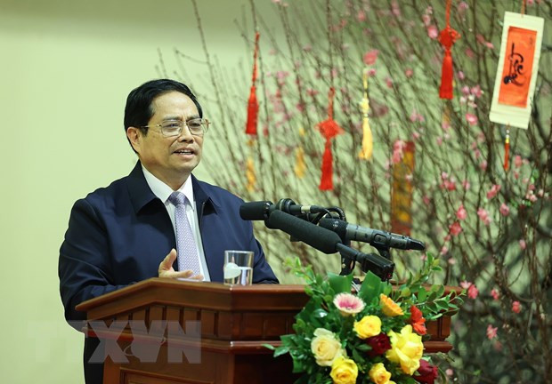 Thủ tướng Phạm Minh Chính chúc Tết và giao nhiệm vụ cho ngành ngân hàng. (Ảnh: Dương Giang/TTXVN)