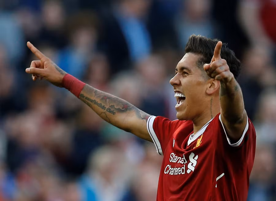  Niềm vui của Firmino sau khi nâng tỉ số lên 3-0 cho Liverpool. Ảnh: REUTERS