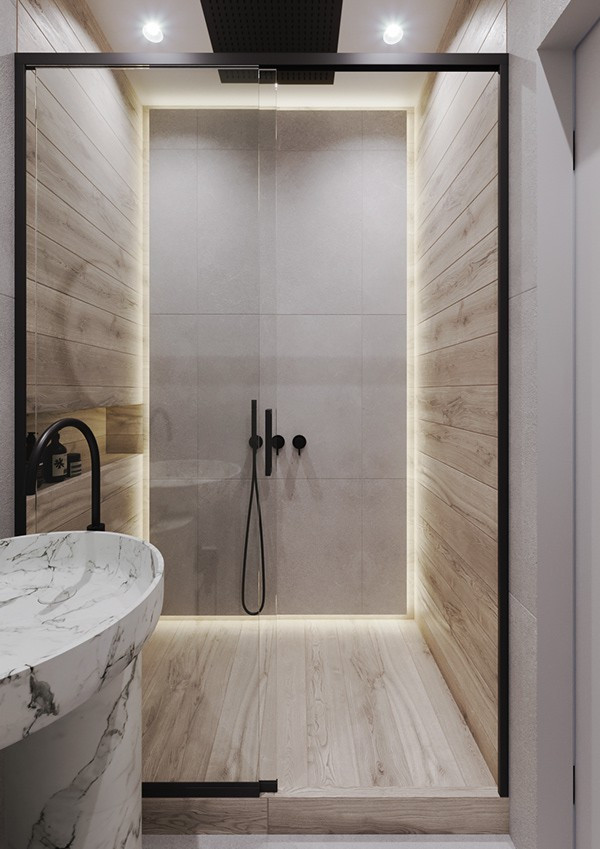 Kệ và chậu rửa làm bằng đá vân mây, tạo độ sâu cho khu vực phòng tắm.