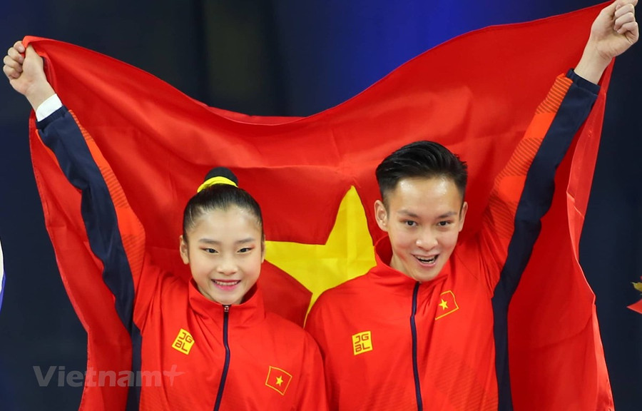 Phan Thế Gia Hiển-Bùi Minh Phương giúp Aerobic lập hat-trick huy chương Vàng. (Ảnh: Vietnam+)