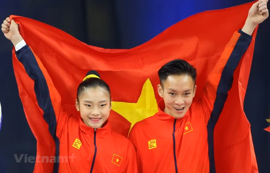 Phan Thế Gia Hiển-Bùi Minh Phương giúp Aerobic lập hat-trick huy chương Vàng. (Ảnh: Vietnam+)