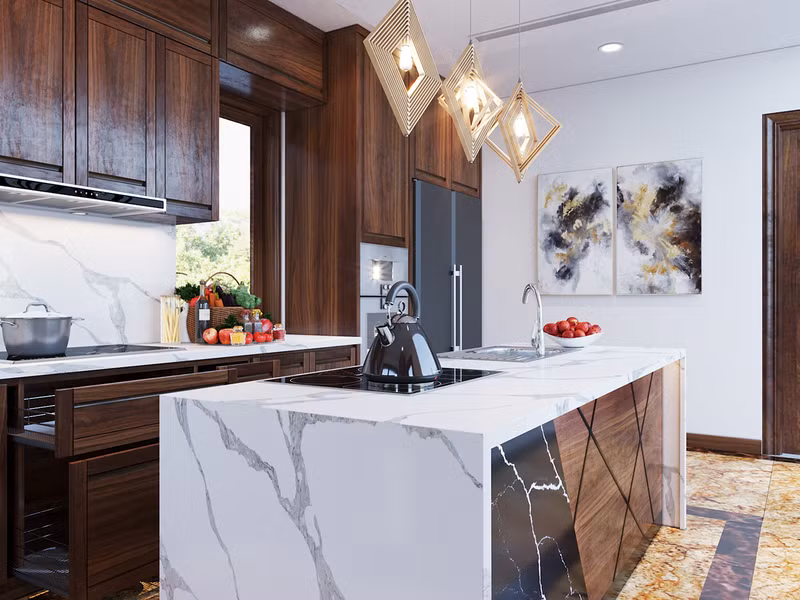 Đảo bếp vừa đóng vai trò như vách ngăn tạm đồng thời còn là nơi lưu trữ và đặt bếp nấu.