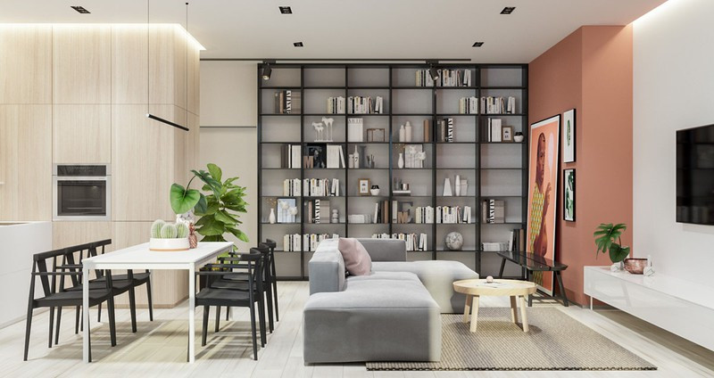 Giá sách đặt cạnh ghế sofa giúp tách biệt phòng khách và phòng ăn mà không cần dùng vách ngăn. Giá sách đặt cạnh ghế sofa giúp tách biệt phòng khách và phòng ăn mà không cần dùng vách ngăn.