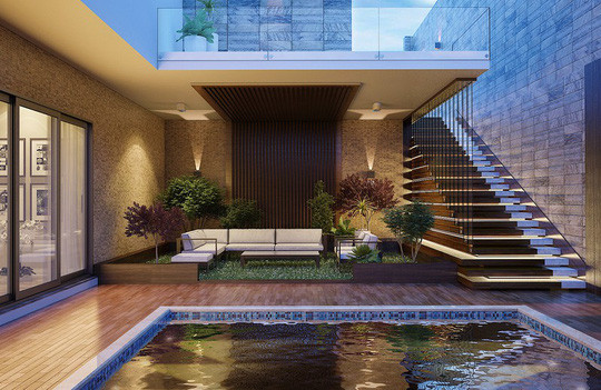 Hồ bơi đặt ngay tại tầng trệt, bên cạnh là bộ bàn ghế để mọi người có thể ngồi nghỉ ngơi.