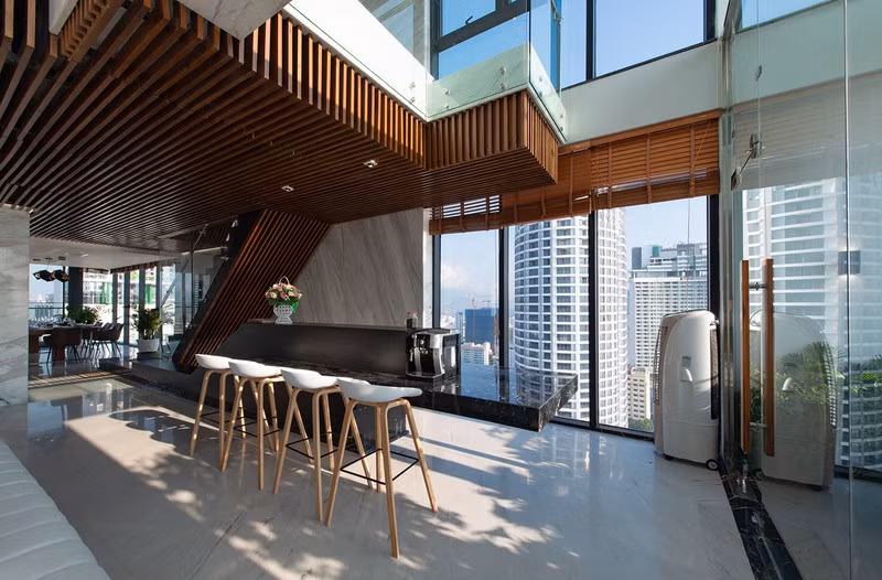  Mặt đảo bếp kéo dài để làm bàn bar.