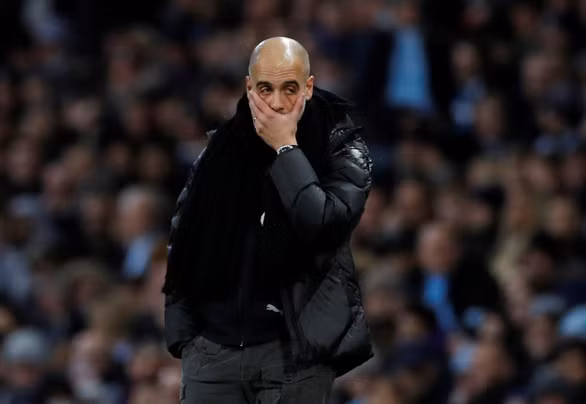 Vẻ mặt thất vọng của HLV Guardiola sau khi M.C thua trận - Ảnh: REUTERS