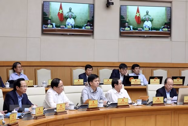 Các thành viên Chính phủ và khách mời tham dự phiên họp. (Ảnh: Thống Nhất/TTXVN)