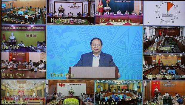 Thủ tướng Phạm Minh Chính, Trưởng Ban Chỉ đạo chủ trì Phiên họp lần thứ 18 Ban Chỉ đạo quốc gia phòng, chống dịch COVID-19 trực tuyến đến 63 tỉnh, thành phố. (Ảnh: Dương Giang/TTXVN)