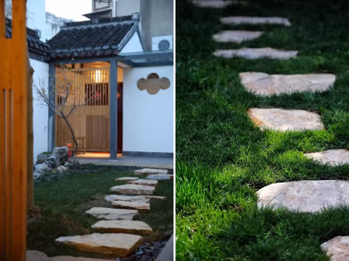 Lối dẫn vào nhà đi qua thảm cỏ xanh, lót đá. Lối dẫn vào nhà đi qua thảm cỏ xanh, lót đá.