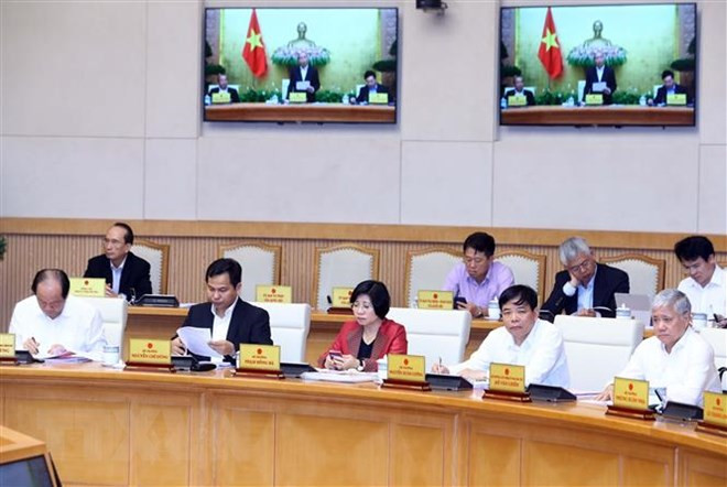 Thành viên Chính phủ và đại biểu tham dự phiên họp. (Ảnh: Thống Nhất/TTXVN)