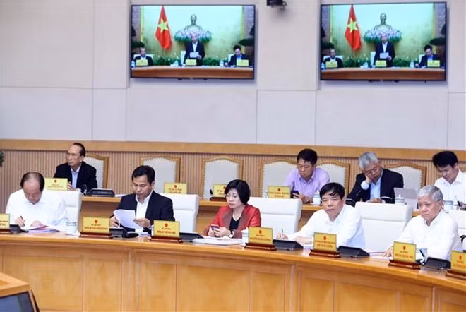 Thành viên Chính phủ và đại biểu tham dự phiên họp. (Ảnh: Thống Nhất/TTXVN)