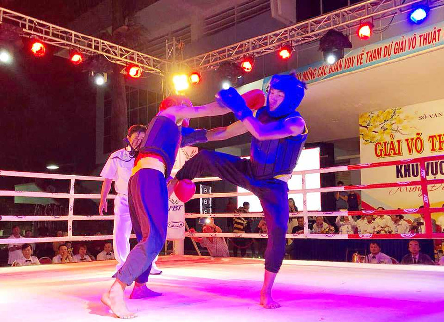 Trận so găng của hai vận động viên đoàn Gia Lai và đoàn Đak Lak. Ảnh: Phan Lài