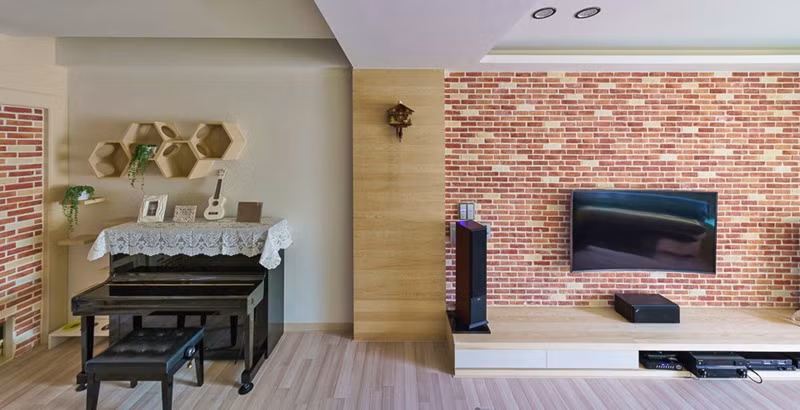 Một chiếc đàn piano bố trí ngay phòng khách phục vụ những giây phút nghỉ ngơi và giải trí vào cuối tuần.