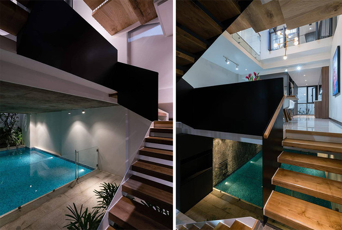 Từ bể bơi, gia chủ có thể lên tầng trên theo hai lối: cầu thang xoắn bằng sắt dưới giếng trời phía sau nhà hay cầu thang gỗ giữa nhà. Dù ở vị trí nào trên cầu thang gỗ, gia chủ cũng dễ dàng ngắm nhìn bể bơi của mình.