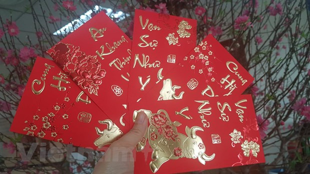 Câu chuyện tiền mừng tuổi đẹp và ý nghĩa là vậy, nhưng xung quanh đó cũng đã có không ít những câu chuyện dở khóc dở cười. (Ảnh: PV/Vietnam+) Câu chuyện tiền mừng tuổi đẹp và ý nghĩa là vậy, nhưng xung quanh đó cũng đã có không ít những câu chuyện dở khóc dở cười. (Ảnh: PV/Vietnam+)