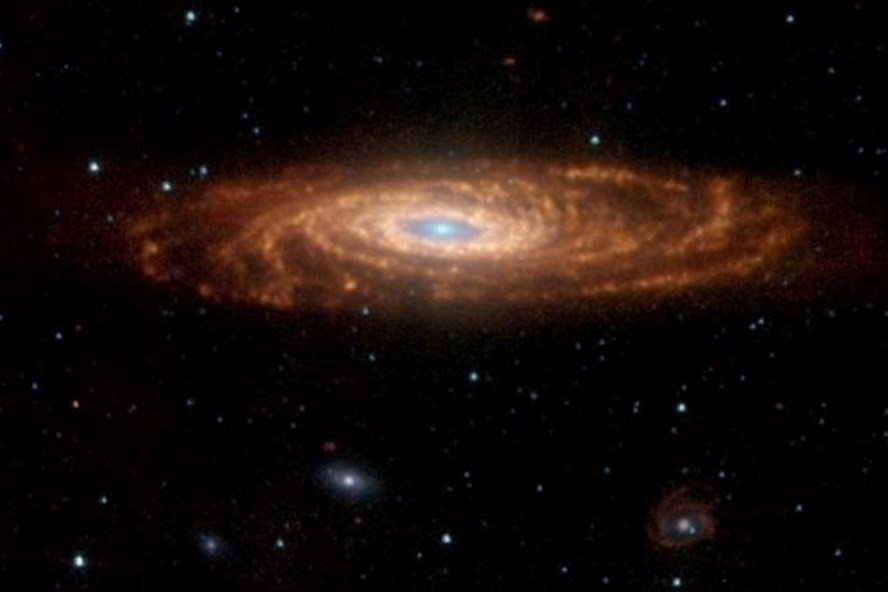 Một thiên hà xoắn ốc tương tự dải Ngân hà quan sát được từ kính thiên văn. Ảnh: AFP