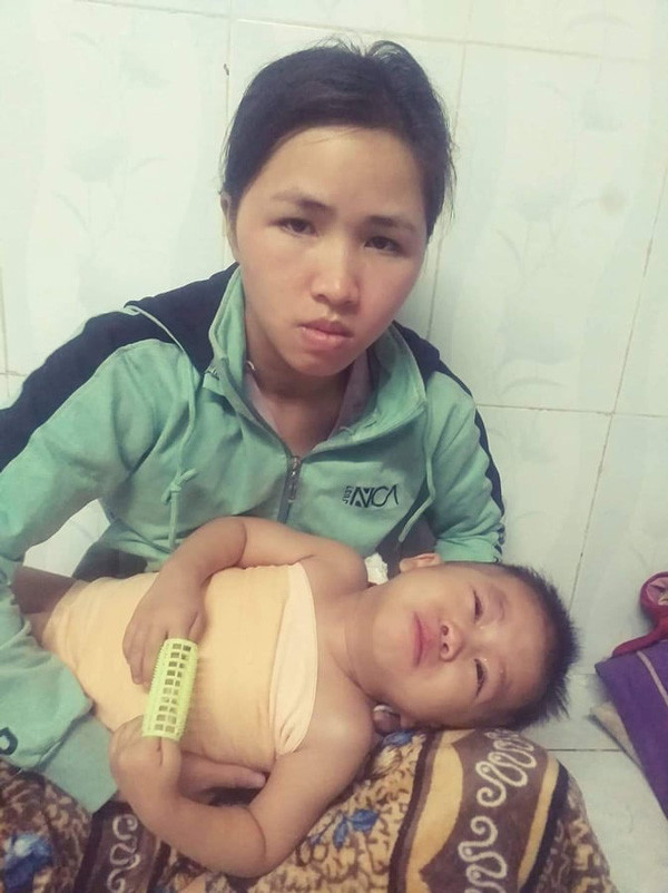 Mẹ con chị Trần Thị Giang. Ảnh: V.M.H