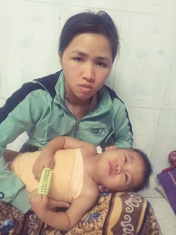 Mẹ con chị Trần Thị Giang. Ảnh: V.M.H