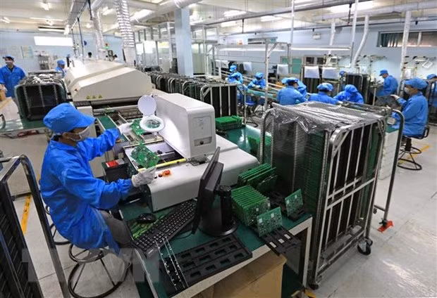  Dây chuyền sản xuất công tơ điện tử. (Ảnh: Ngọc Hà/TTXVN)