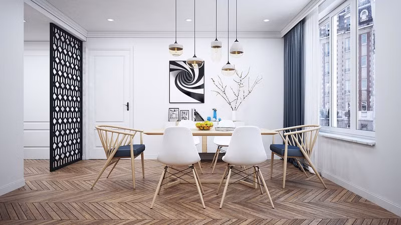 Vẫn sử dụng tông màu trắng chủ đạo, phòng ăn được nhấn nhá thêm một vài bức tranh tường và bình hoa mang đến vẻ đẹp nhẹ nhàng.