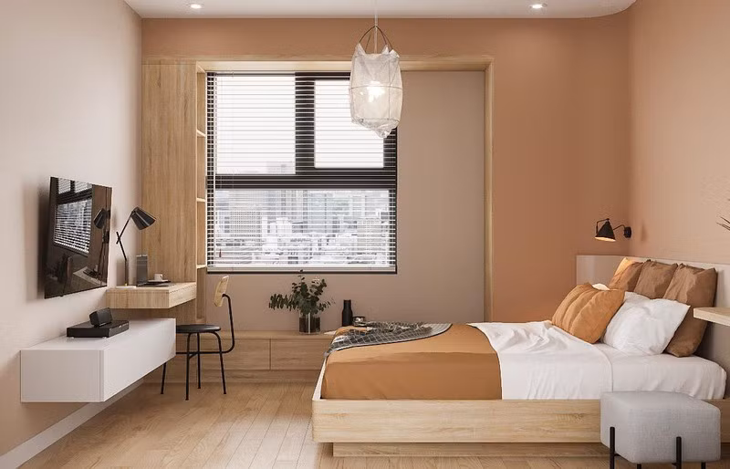 Bàn làm việc gắn vào tường trả lại không gian rộng rãi để chủ nhà nghỉ ngơi.