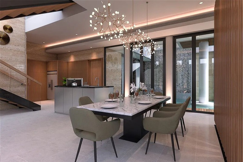 Bàn ăn mặt đá, phù hợp với bố cục sang trọng và hiện đại của căn phòng.