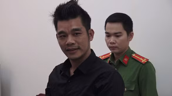  Võ Thanh Long tại cơ quan công an- Ảnh: HUY PHÁCH