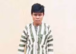 Đối tượng Đinh Văn Mu (32 tuổi, làng Đăk Tơ Lông, xã Sơn Lang, huyện Kbang), chủ mưu trong vụ cưa gỗ cổ thụ trái phép tại Khu Bảo tồn thiên nhiên Kon Chư Răng (huyện Kbang, tỉnh Gia Lai). Ảnh: Ngọc Thu 