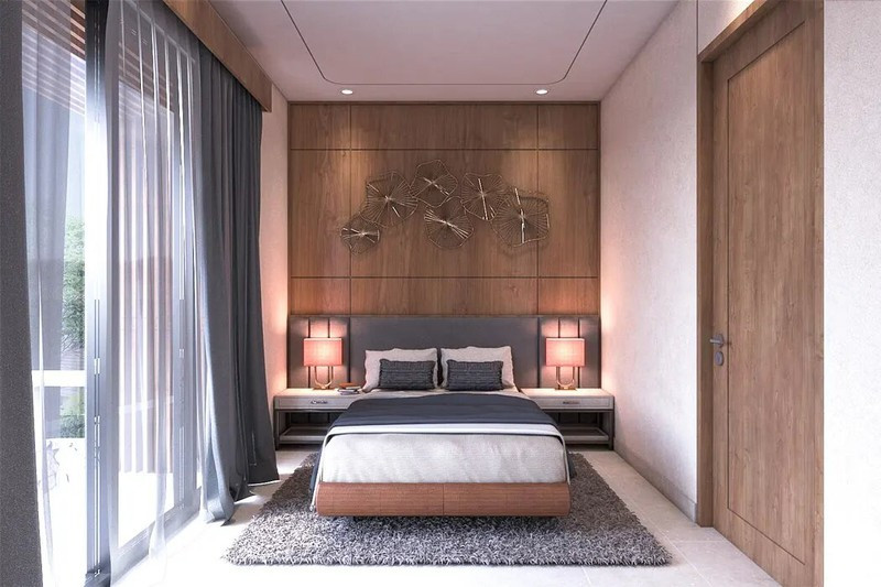 Vẫn là gỗ, thảm và cửa kính trượt tạo sự gắn kết giữa các phòng ngủ, cũng như phòng ngủ với hồ nước và khoảng sân vườn.