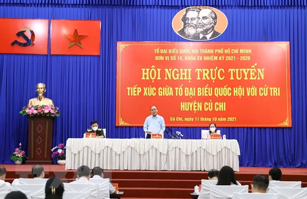 Chủ tịch nước Nguyễn Xuân Phúc phát biểu tại điểm cầu thị trấn Củ Chi. (Ảnh: Thống Nhất/TTXVN)