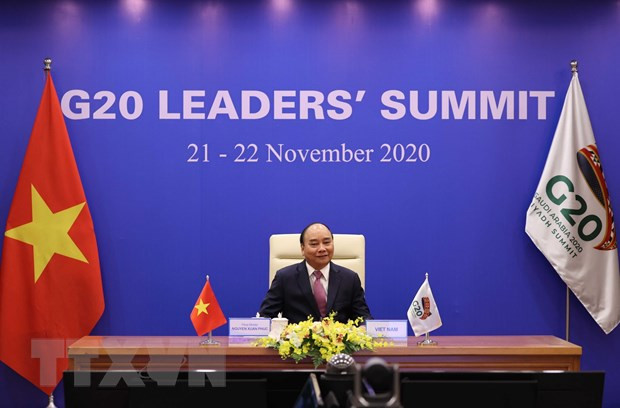 Thủ tướng Nguyễn Xuân Phúc dự phiên thảo luận Hội nghị thượng đỉnh nhóm các nền kinh tế phát triển và mới nổi hàng đầu thế giới (G20) ngày 22/11. (Ảnh: Thống Nhất/TTXVN)