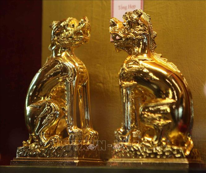 Hình tượng linh vật Nghê Việt được trưng bày tại triển lãm. Ảnh: Thanh Tùng/TTXVN