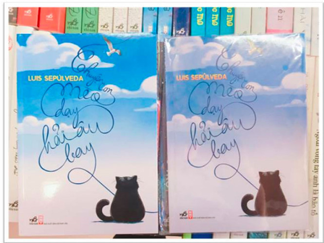 Sách Chuyện con mèo dạy hải âu bay thật (trái) và giả ẢNH: NHÃ NAM