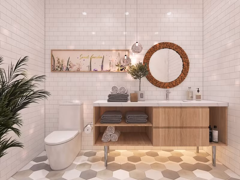 Trong phòng tắm, chủ đầu tư hoàn toàn loại bỏ những chi tiết thừa thãi, làm rối bố cục. Sàn lát bằng đá hình tổ ong cùng với đèn led, cây xanh mang đến sức sống cho căn phòng.
