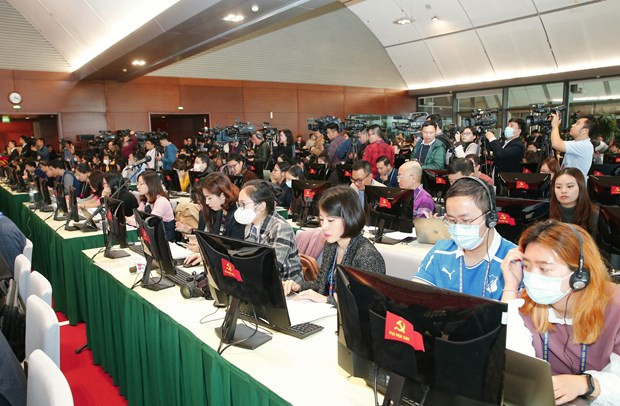  Các phóng viên tác nghiệp tại Trung tâm Báo chí. (Ảnh: Doãn Tấn/TTXVN)