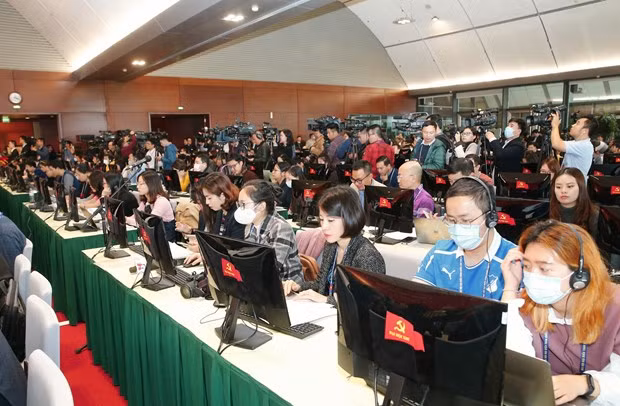 Các phóng viên tác nghiệp tại Trung tâm Báo chí. (Ảnh: Doãn Tấn/TTXVN) Các phóng viên tác nghiệp tại Trung tâm Báo chí. (Ảnh: Doãn Tấn/TTXVN)