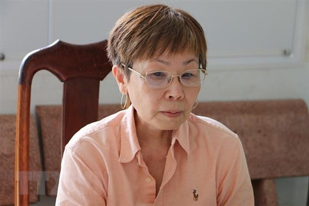 Đối tượng Phan Thị Kim Anh tại cơ quan công an. (Ảnh: TTXVN phát)